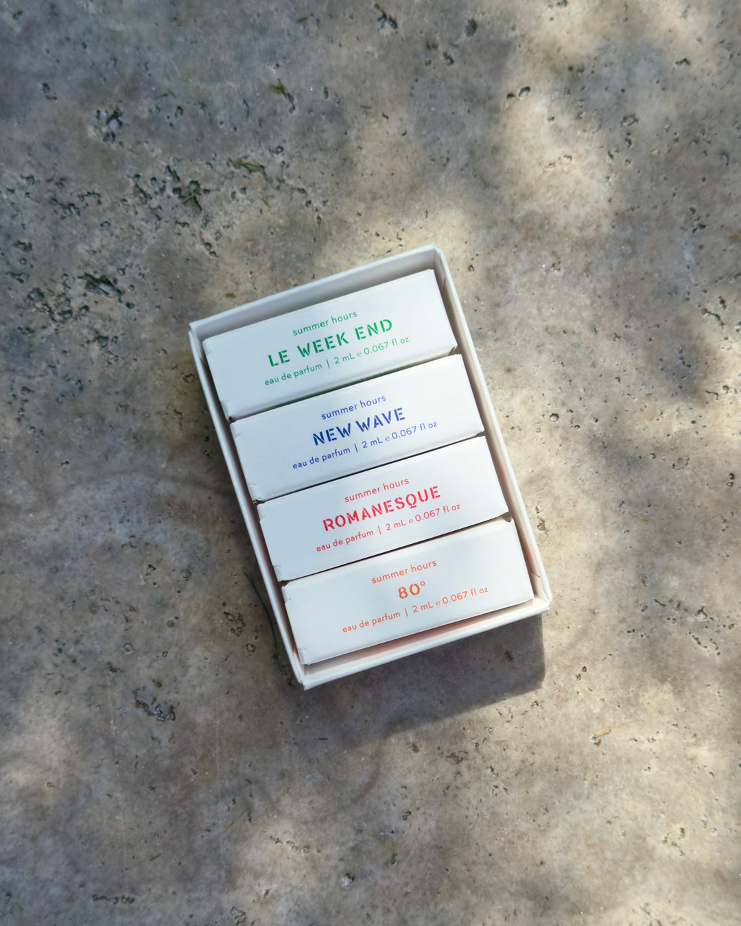 Summer Hours Discovery Set of four perfume boxes titled Le Week End, New Wave, Romy, and 80 °