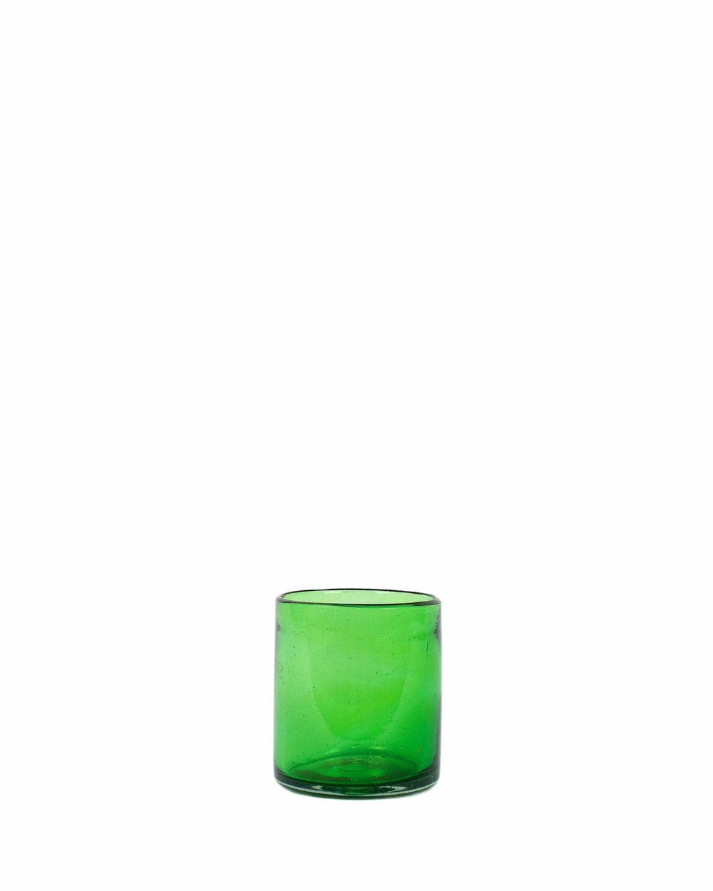 One green glass tumbler